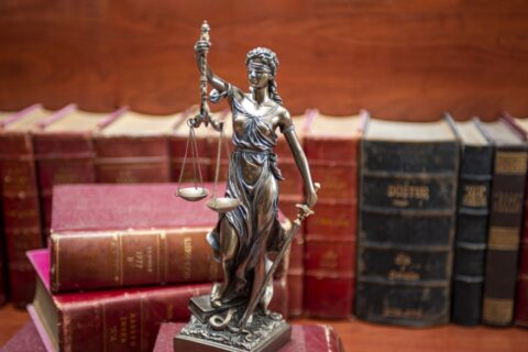 Statue of justice and law books - Hire a Lawyer in Ogden, UT